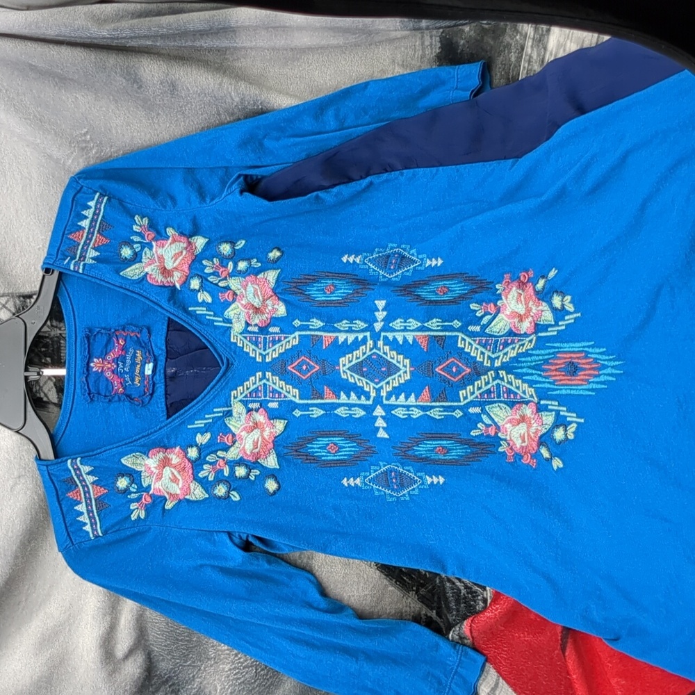 Johnny was blue embroidered shirt